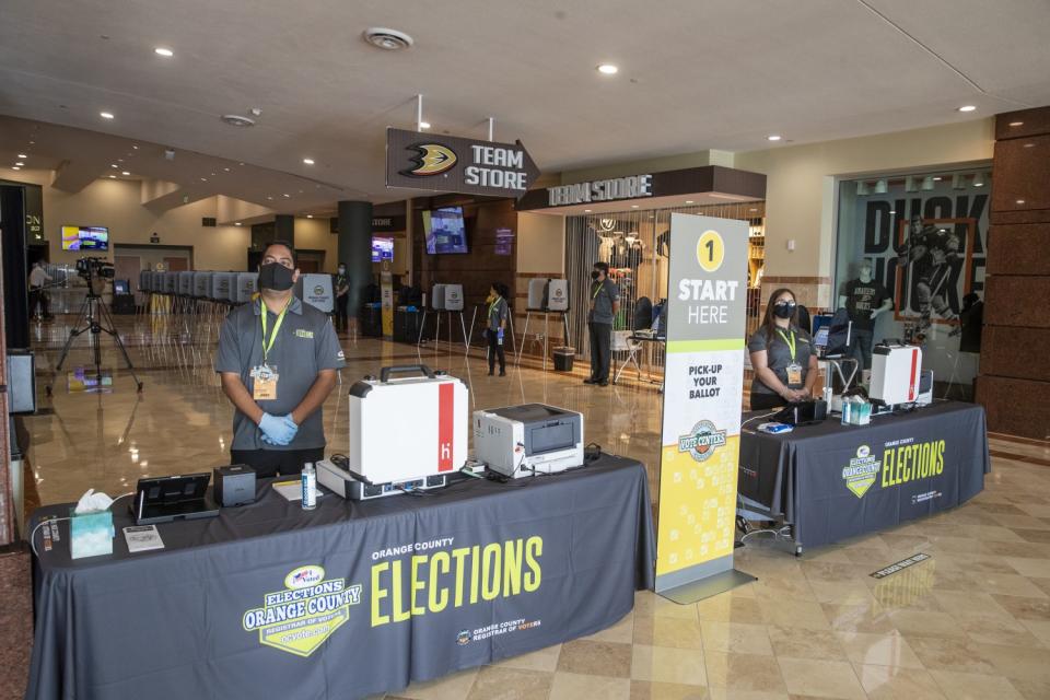 Orange County Registrar of Voters election services workers stand by at the "Super Vote Center Site."