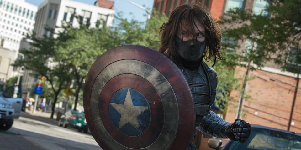 sebastian stan with captain america's shield in the winter soldier