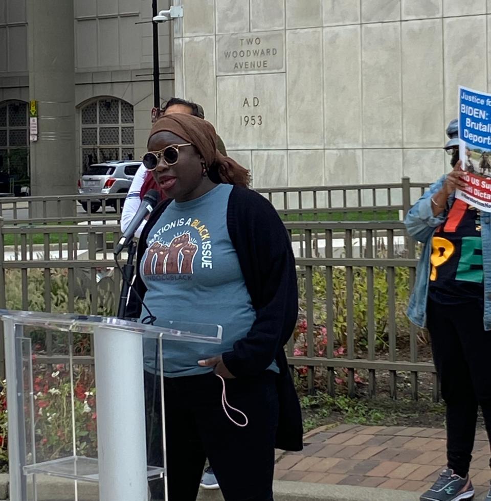 Fatou-Seydi Sarr, a Detroit immigrant from Senegal who is founder of the African Bureau for Immigration and Social Affairs, speaks at a rally for Haitian migrants at the Spirit of Detroit statue Sept. 26, 2021 in Detroit.