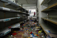 <p>A store is left in disarray after it was looted by demonstrators in La Fria, Venezuela, Dec. 19, 2016. (Carlos Eduardo Ramirez/Reuters) </p>