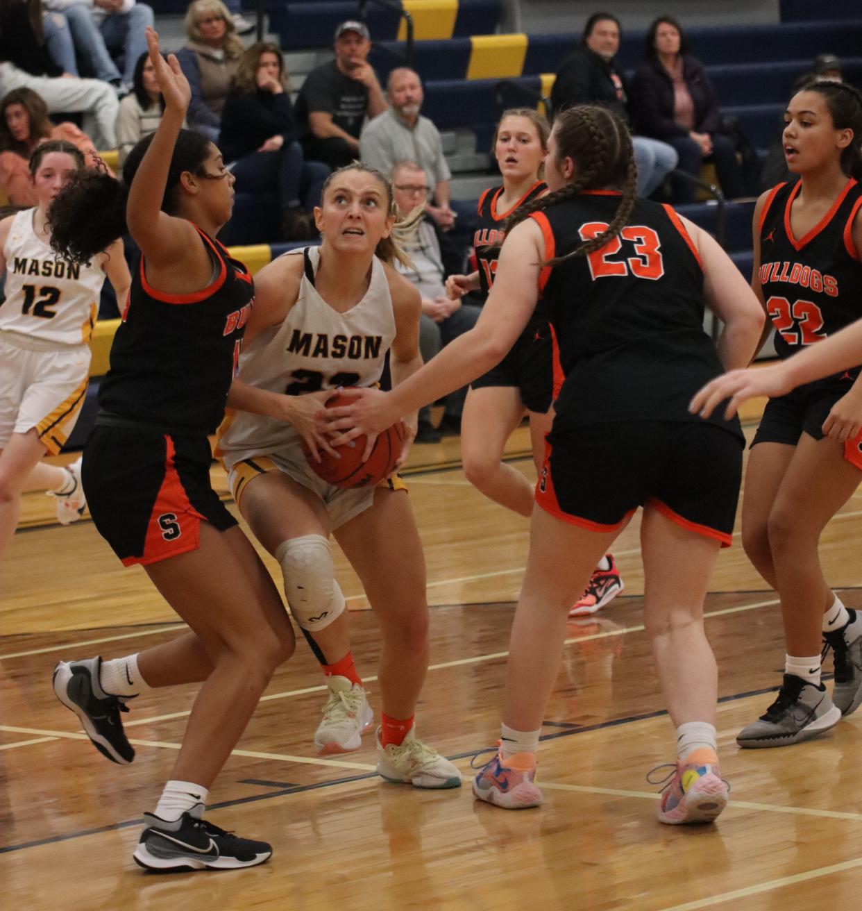 Kaylee Bash of Erie Mason is surrounded by Summerfield defenders Friday night during a 58-31 Summerfield win.