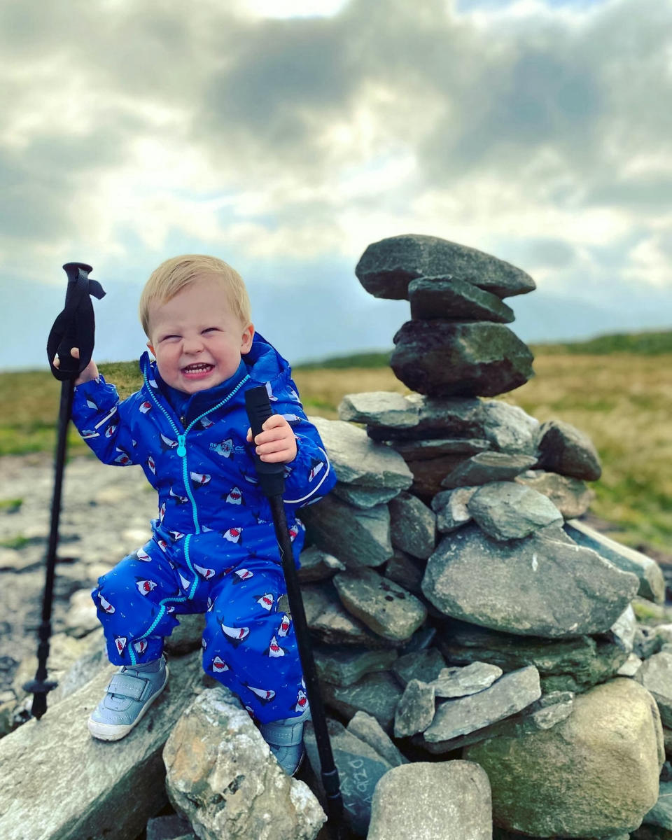 A baby was on top of the world as he tottered around a mountain summit. Little Joel Russell, 18 months, was carried up the top of Beinn Dubh, near Helensburgh, Argyll and Bute, by his dad, Kyle, 27. The tot, who has been walking since he was a year old, was given walking poles which Kyle made small enough for him to use. Dad-of-two Kyle said: "He was saying 'where are we going, where are we going?'."