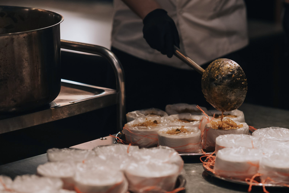 Volunteers prepare potato pirattal. (PHOTO: Straits Clan)