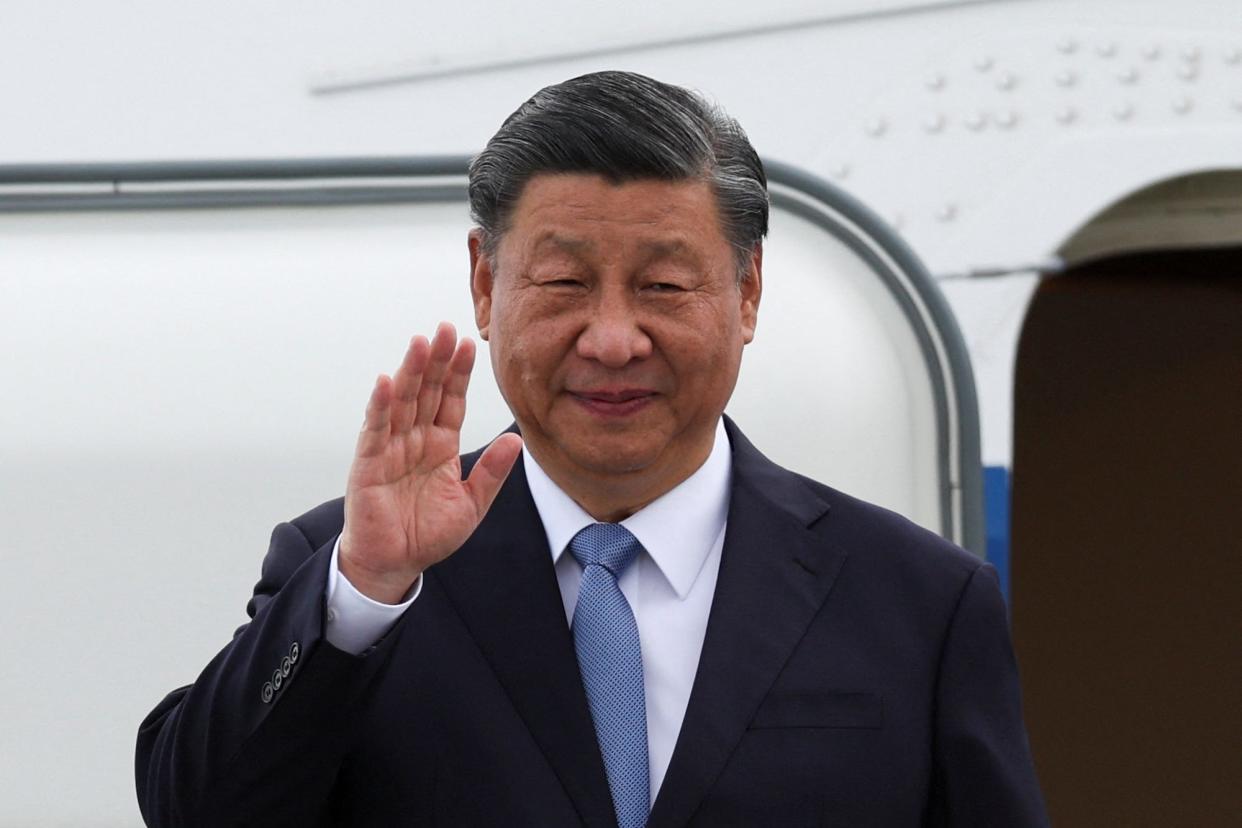 Chinese President Xi Jinping waves