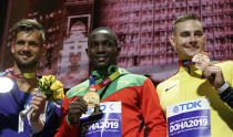 From left, silver medalist Magnus Kirt, of Estonia, gold medalist Anderson Peters, of Grenada, and bronze medalist Johannes Vetter, of Germany, display their medals at the World Athletics Championships in Doha, Qatar, Sunday, Oct. 6, 2019. (AP Photo/Morry Gash)