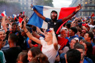 <p>Fans react in a fan zone at the Hotel de Ville after France defeated Belgium in the World Cup semi-final match. REUTERS/Philippe Wojazer </p>