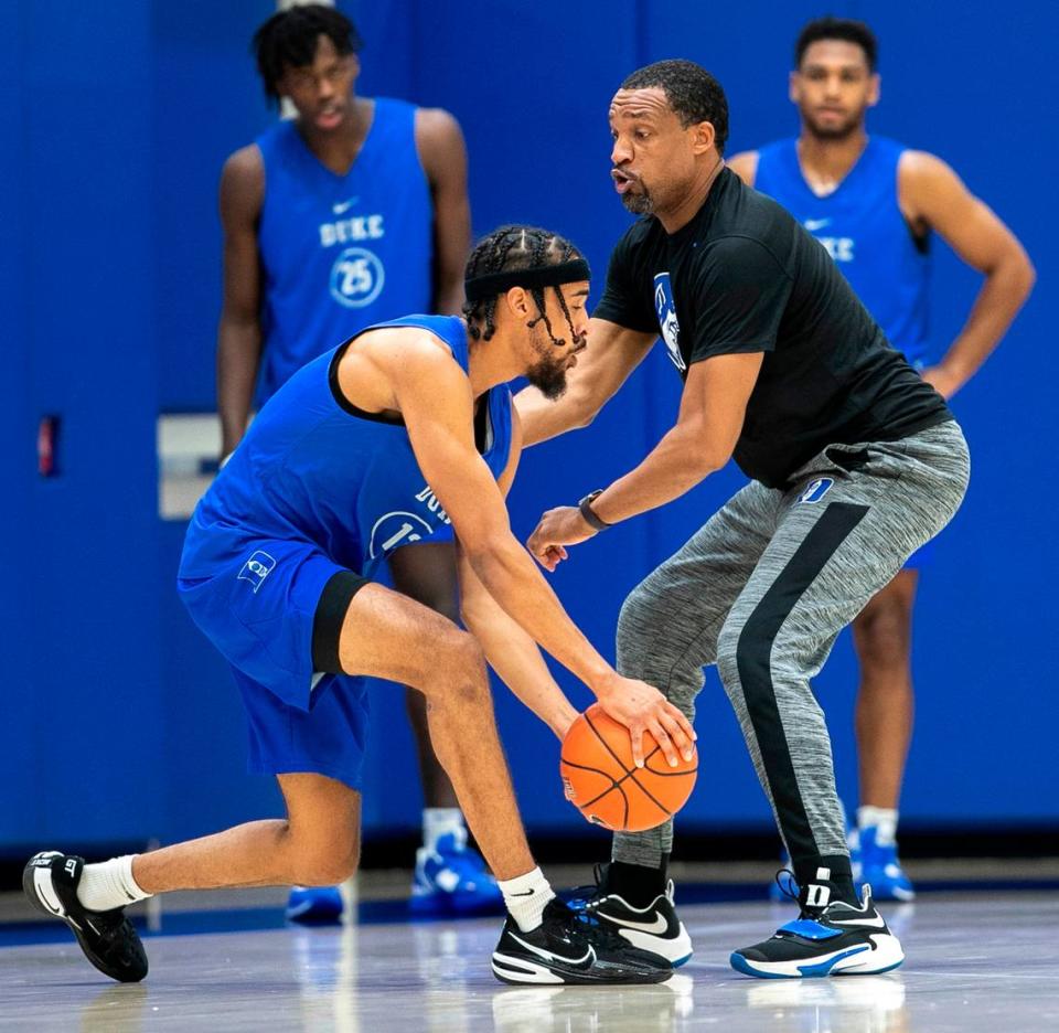 Duke associate coach Chris Carrawell works with transfer Jacob Grandison (13) during the Blue Devils’ practice on Tuesday, September 27, 2022 in Durham, N.C.