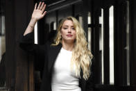 Amber Heard arrives at High Court, in London, Monday, July 27, 2020. Hollywood actor Johnny Depp is suing News Group Newspapers over a story about his former wife Amber Heard, published in The Sun in 2018 which branded him a 'wife beater', a claim he denies.(AP Photo/Alberto Pezzali)