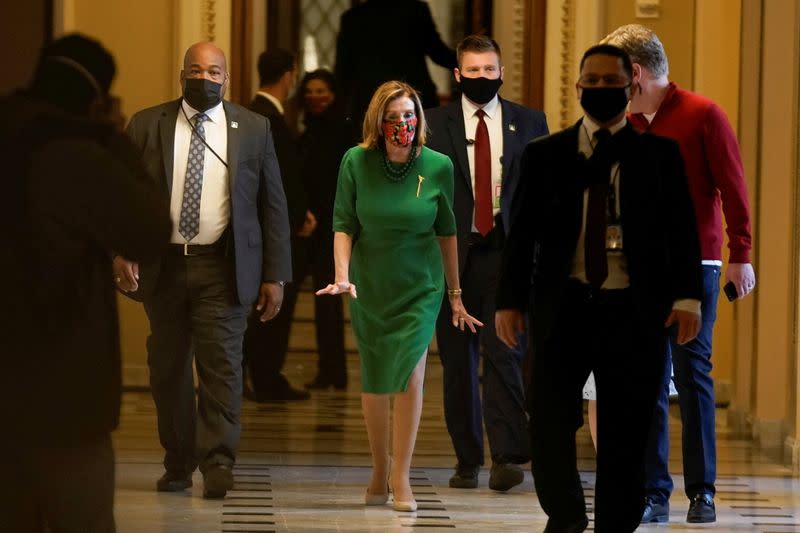 Speaker of the House Nancy Pelosi (D-CA) walks back to her office after opening the House floor following an agreement of a coronavirus disease (COVID-19) aid package, in Washington