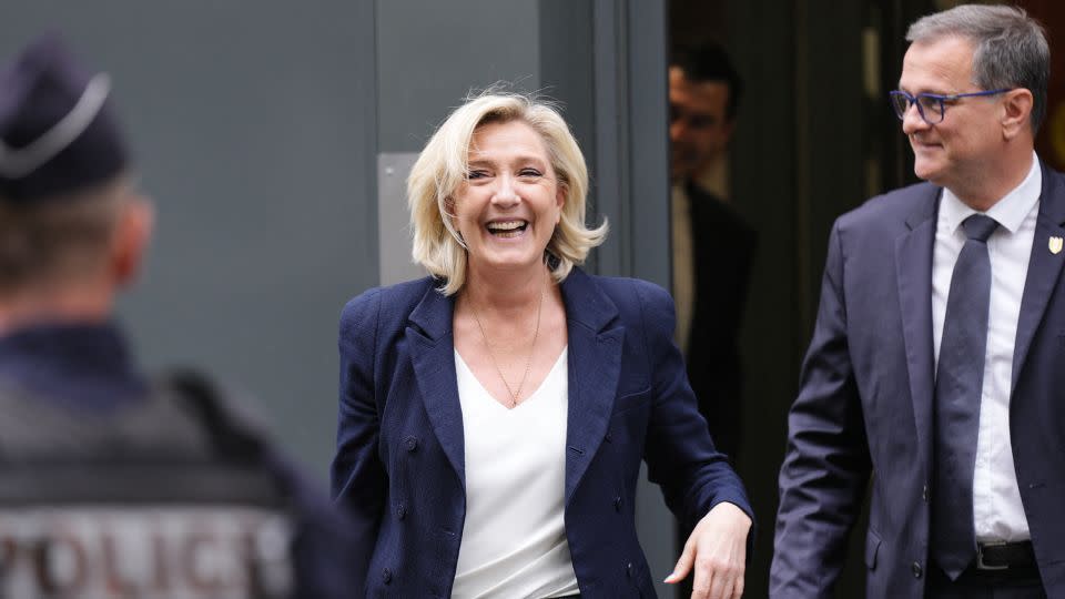 Former president of the French far-right National Rally, or Rassemblement National (RN) parliamentary group Marine Le Pen and RN Mayor of Perpignan Louis Aliot leave the party's headquarters in Paris on July 2, 2024. - Dimitar Dilkoff/AFP/Getty Images