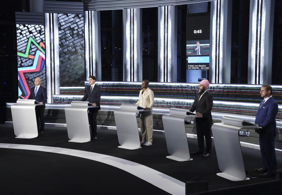 From left to right, Conservative leader Erin O'Toole, Liberal leader Justin Trudeau, Green leader Annammie Paul, New Democratic Party leader Jagmeet Singh and Bloc leader Yves-Francois Blanchet stand at their podiums before the federal election French-language leaders debate, Wednesday, Sept. 8, 2021, in Gatineau, Quebec. (Sean Kilpatrick/The Canadian Press via AP)