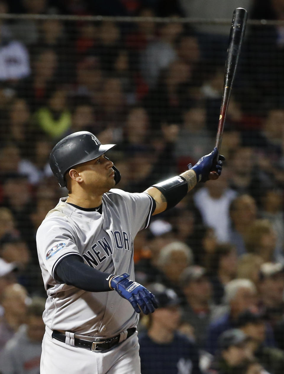 New York Yankees' Gary Sanchez watches his three-run home run against the Boston Red Sox during the seventh inning of Game 2 of a baseball American League Division Series, Saturday, Oct. 6, 2018, in Boston. (AP Photo/Elise Amendola)