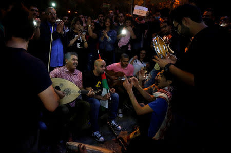 Protesters play music and sing during a protest in Amman, Jordan, June 5, 2018. REUTERS/Muhammad Hamed