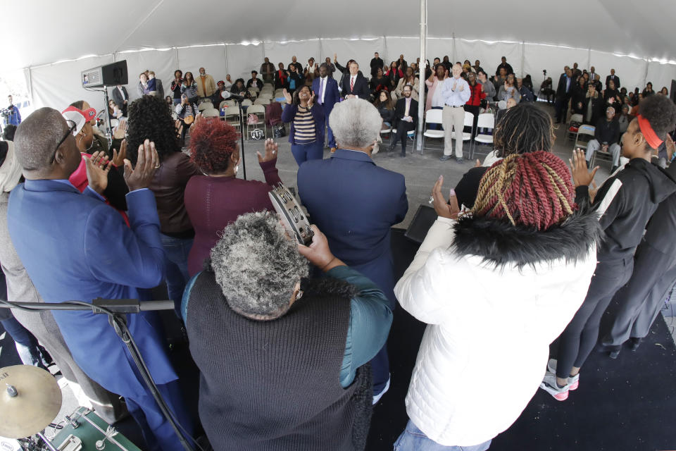 A choir performs during a worship service in a tent at Mount Bethel Missionary Baptist Church, Sunday, March 8, 2020, in Nashville, Tenn. The congregation held their Sunday service in a tent in the parking lot near the church facilities, which were heavily damaged by a tornado March 3. (AP Photo/Mark Humphrey)