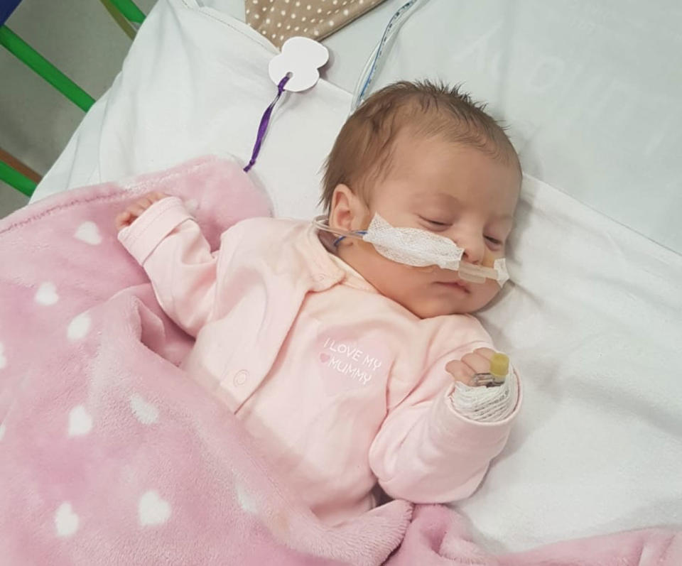 Parents Sophie and Thomas Hobbs said their baby Eliza nearly died from a chest infection caused by a stranger kissing her. Source: Caters