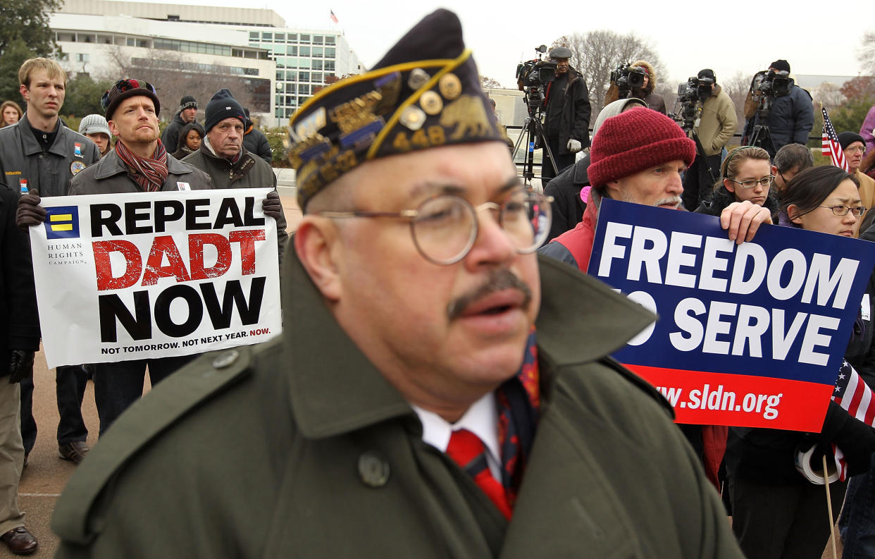 WASHINGTON, DC - DECEMBER 10:  Activists listen during a rally on 