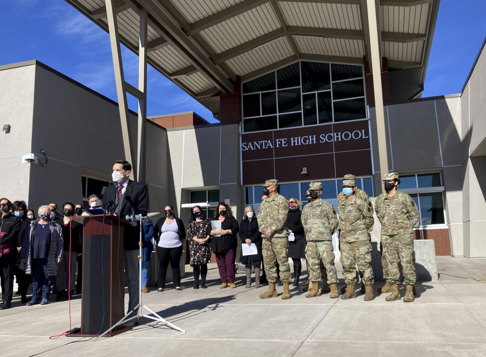 New Mexico Public Education Secretary Kurt Steinhaus announced an initiative to shore up public school substitute teaching on a voluntary basis with National Guard troops and state bureaucrats, at Sante Fe High School in Santa Fe, N.M., on Tuesday, Jan. 19, 2022. Santa Fe's public school district closed its classrooms this week because of staffing shortages as teachers stay home sick or as a precaution against the spread of COVID-19. (AP Photo/Morgan Lee)