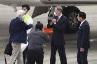 From left, former U.S. senator Chris Dodd, is greeted by Brant Christensen director of American Institute in Taiwan, center as Taiwan Foreign Minister Joseph Wu at right looks on in Taipei, Taiwan on Wednesday, April 14, 2021. The former U.S. senator and two ex-State Department officials arrived in Taiwan on Wednesday at a time of tense relations with China, Taiwan's Foreign Ministry said. (Pool Photo via AP)