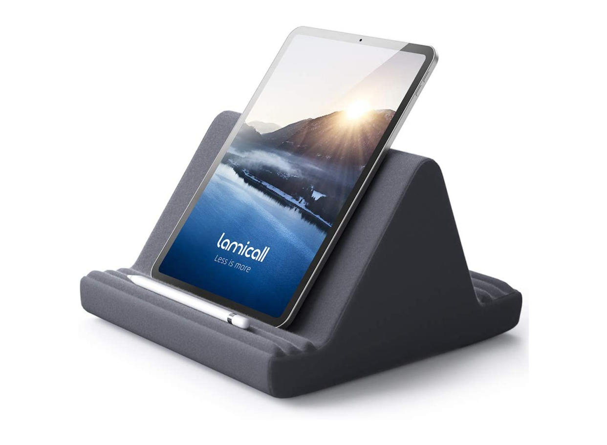 A tablet pillow stand makes a great gift for readers who prefer e-books. (Source: Amazon)