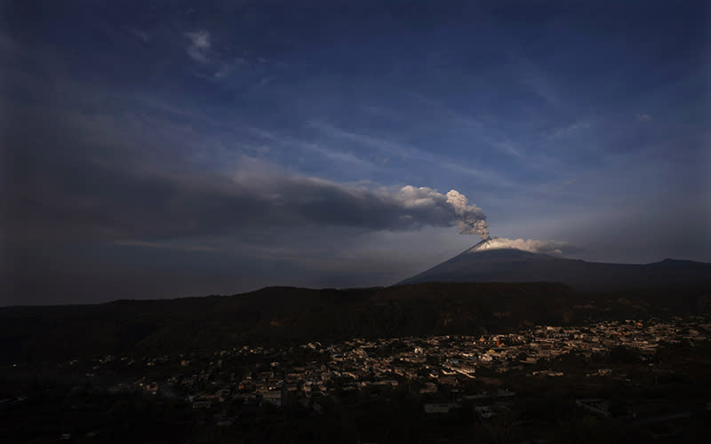 The Popocatepetl volcano spews ash and steam