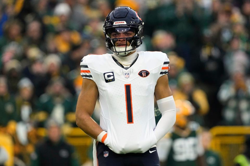 Jan 7, 2024; Green Bay, Wisconsin, USA; Chicago Bears quarterback Justin Fields (1) during the game against the Green Bay Packers at Lambeau Field. Mandatory Credit: Jeff Hanisch-USA TODAY Sports