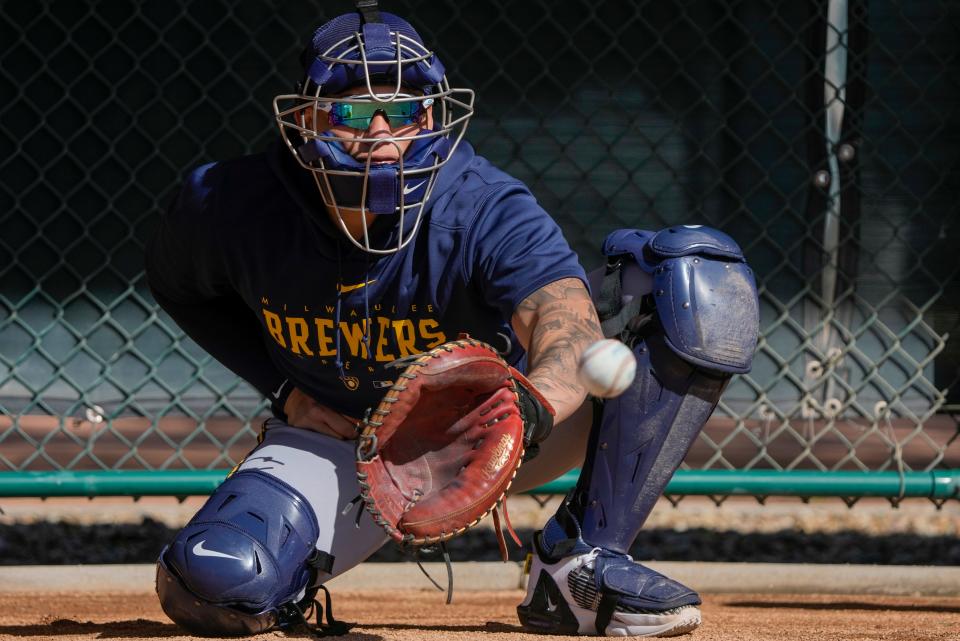 William Contreras catches during a spring training baseball workout Feb. 16 in Phoenix.