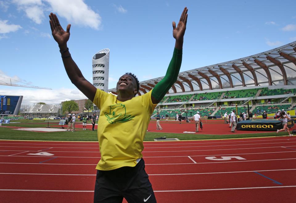 Oregon's Emmanuel Ihemeje celebrates his win in the men's triple jump with fans during his victory lap at the Pac-12 Track & Field Championships at Hayward Field in Eugene, Oregon May 15, 2022.