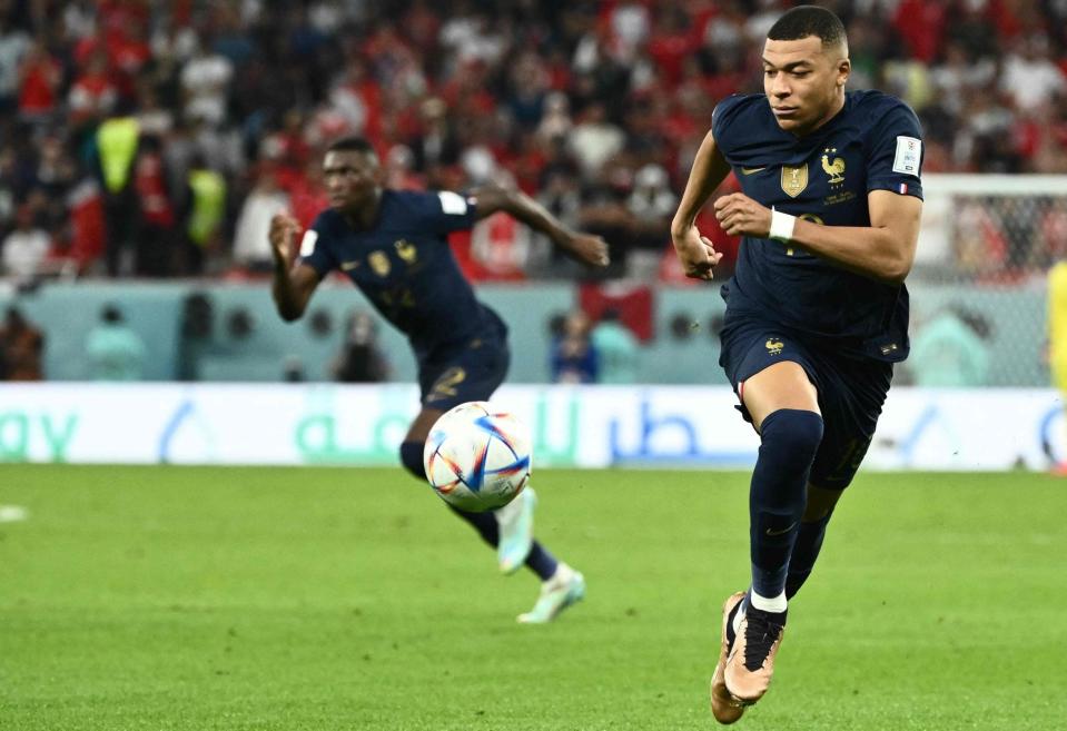 France's forward #10 Kylian Mbappe runs with the ball during the Qatar 2022 World Cup Group D football match between Tunisia and France at the Education City Stadium in Al-Rayyan, west of Doha on November 30, 2022 - JEWEL SAMAD/AFP via Getty Images