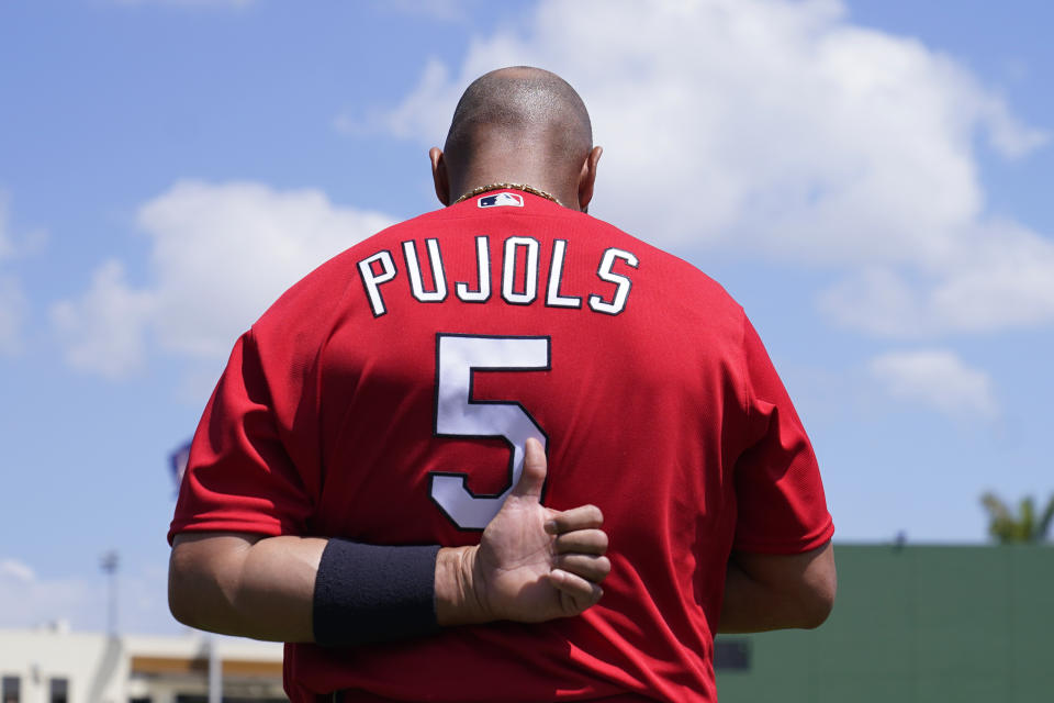 St. Louis Cardinals' Albert Pujols stands for the national anthem before a spring training baseball game against the Washington Nationals, Wednesday, March 30, 2022, in West Palm Beach, Fla. (AP Photo/Sue Ogrocki)
