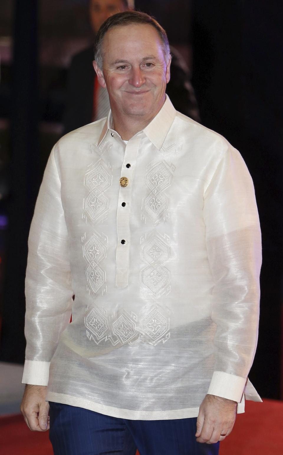 New Zealand's Prime Minister John Key arrives in a traditional barong for a welcome dinner during the Asia-Pacific Economic Cooperation (APEC) summit in Manila