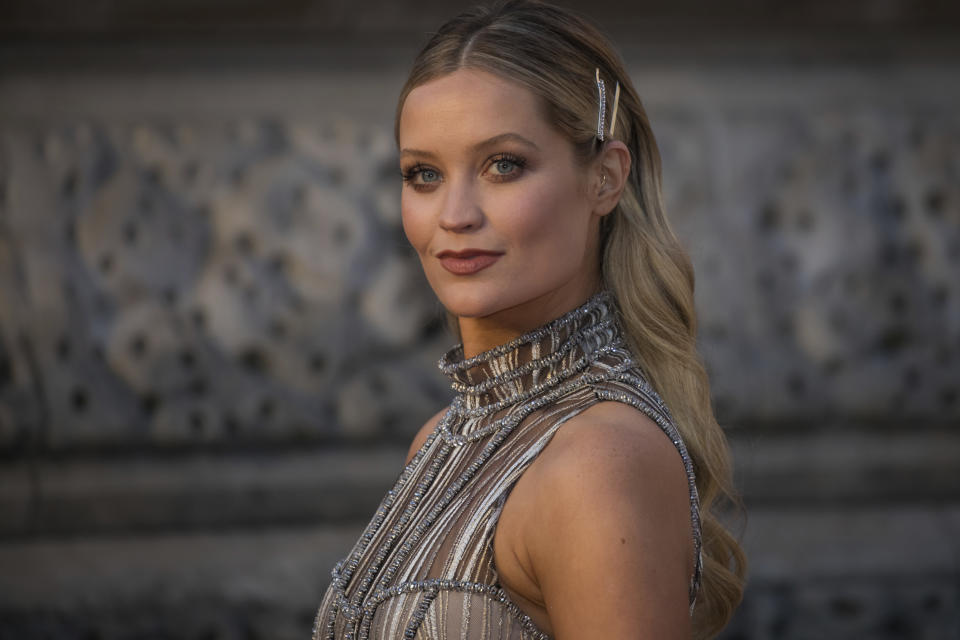 Laura Whitmore poses for photographers upon arrival at the BAFTA Film Awards in London, Sunday, Feb. 10, 2019. (Photo by Vianney Le Caer/Invision/AP)