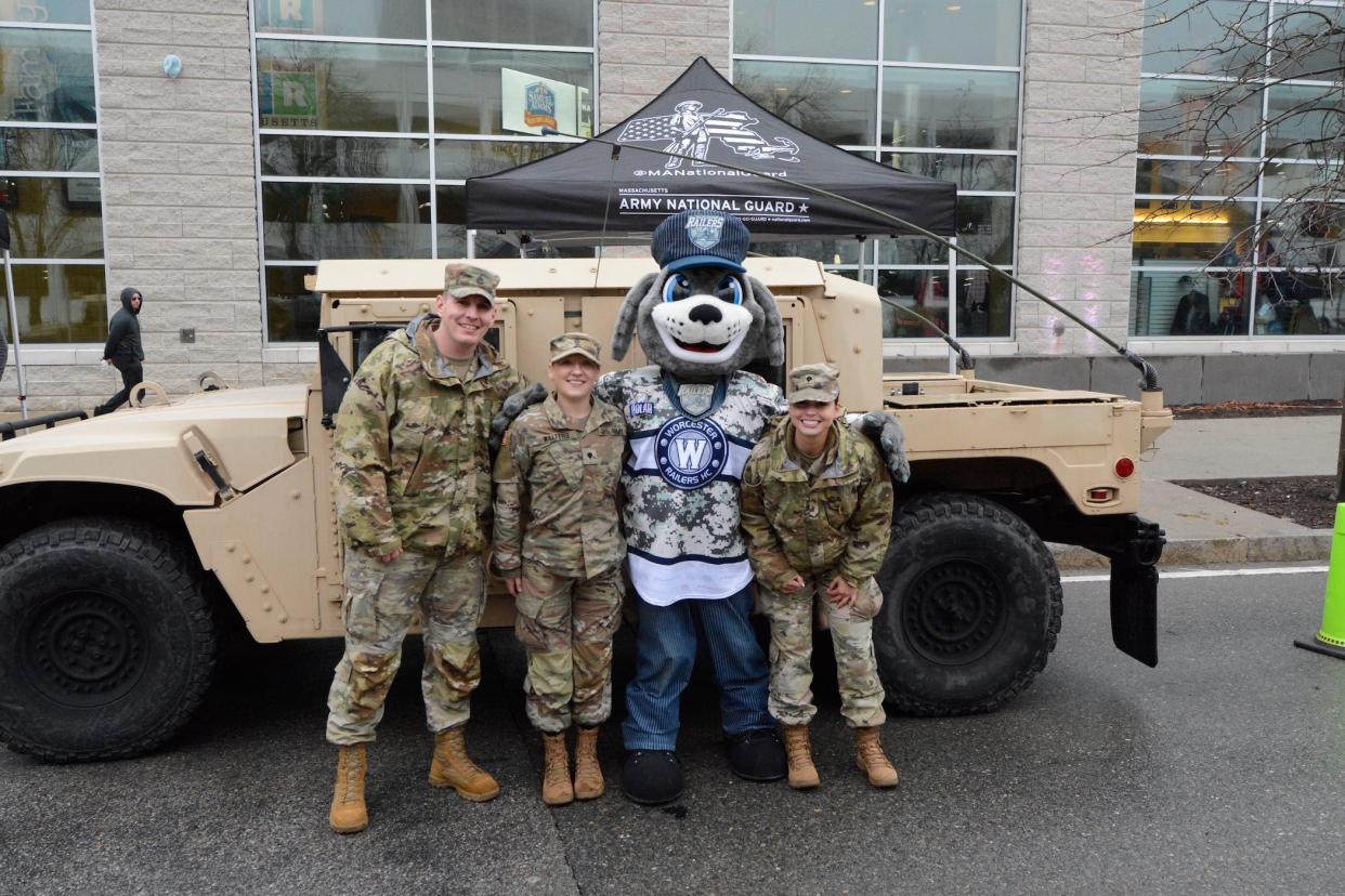 The Railers' mascot Trax appears with members of the Army National Guard. The Railers will host a Military Appreciation Night April 1 at the DCU Center.
