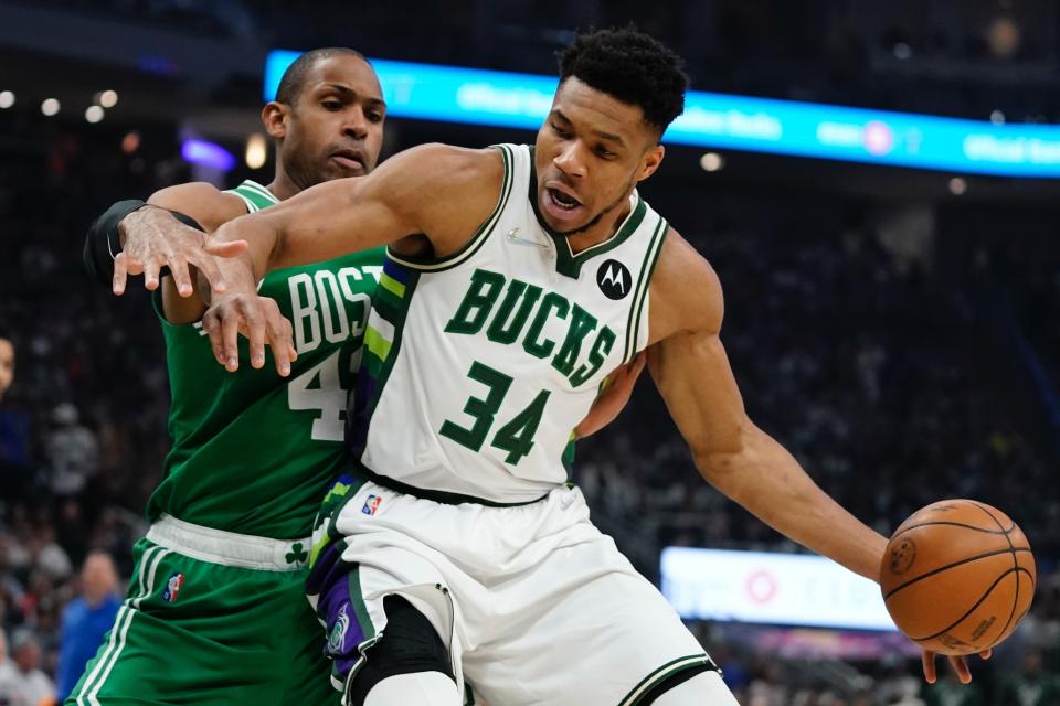Milwaukee Bucks' Giannis Antetokounmpo tries to get past Boston Celtics' Al Horford during the first half of Game 3 of an NBA basketball Eastern Conference semifinals playoff series Saturday, May 7, 2022, in Milwaukee. (AP Photo/Morry Gash)
