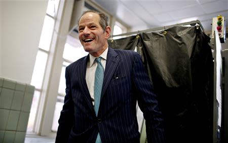 Former New York State Governor and current Democratic candidate for New York City Controller Eliot Spitzer emerges from a voting booth after casting his vote in the Democratic primary election on Manhattan's upper east side in New York, September 10, 2013. REUTERS/Mike Segar