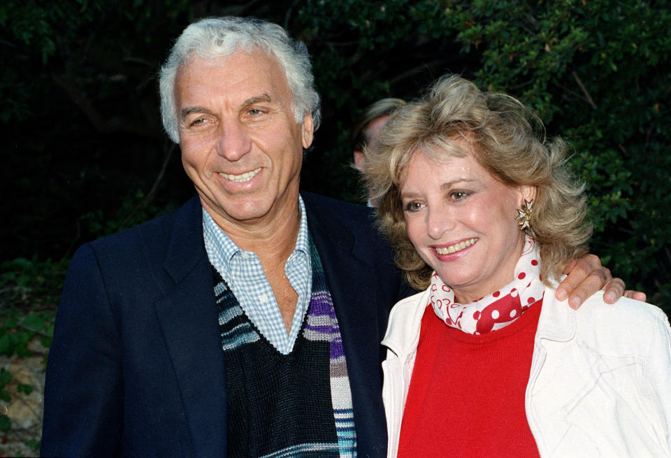 FILE - ABC television newscaster Barbara Walters poses with her husband, Merv Adelson, in November 1986. Walters, a superstar and pioneer in TV news, has died, according to ABC News on Friday, Dec. 30, 2022. She was 93. (AP Photo, File)