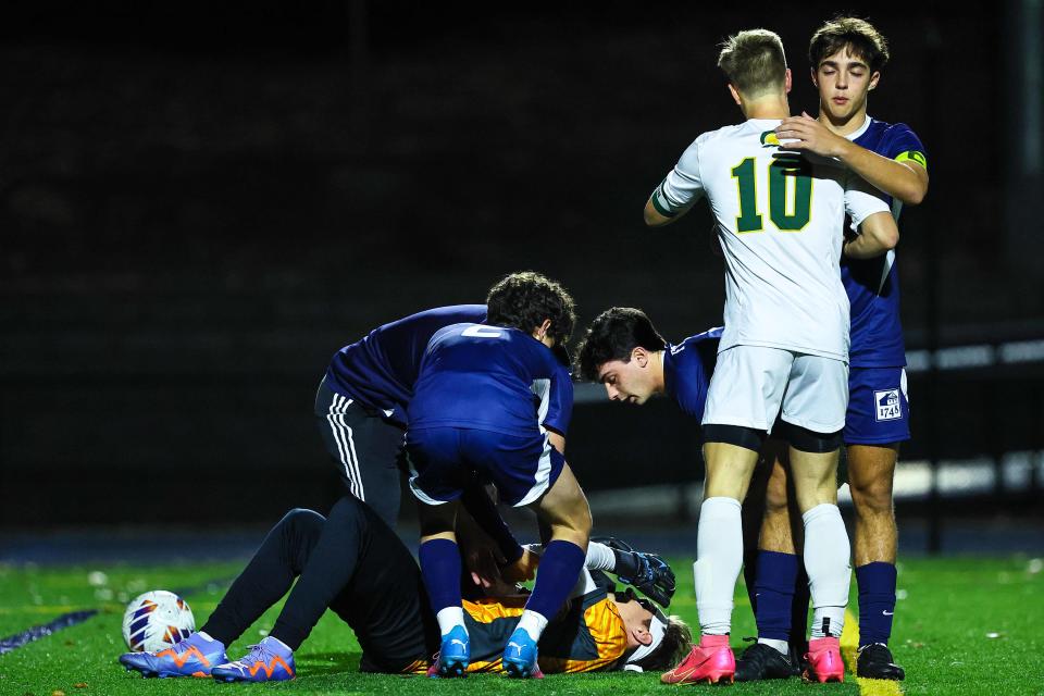 Saint Mark’s Chad Dohl (10) and Wilmington Friends Attacker James Green (6) embrace each other after Saint Mark’s scored the final goal during penalty kicks during a high school boys semifinal soccer match between Saint Mark’s and Wilmington Friends Wednesday, Nov. 15, 2023, at Abessinio Stadium in Wilmington, DE.