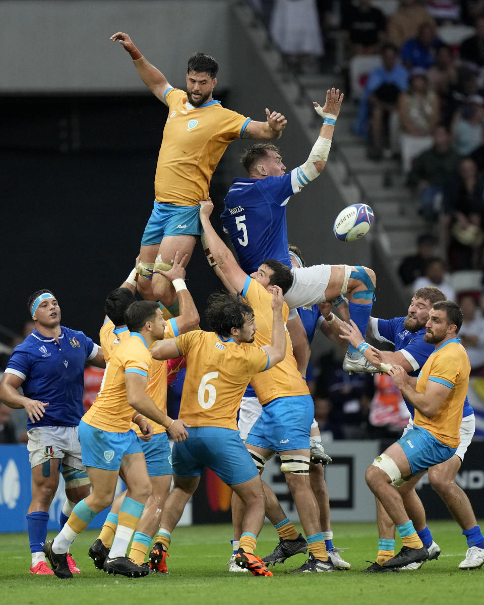 Italy's Federico Ruzza, top right, wins a line out against Uruguay's Manuel Leindekar during the Rugby World Cup Pool A match between Italy and Uruguay at the Stade de Nice, in Nice, Wednesday, Sept. 20, 2023. (AP Photo/Pavel Golovkin)