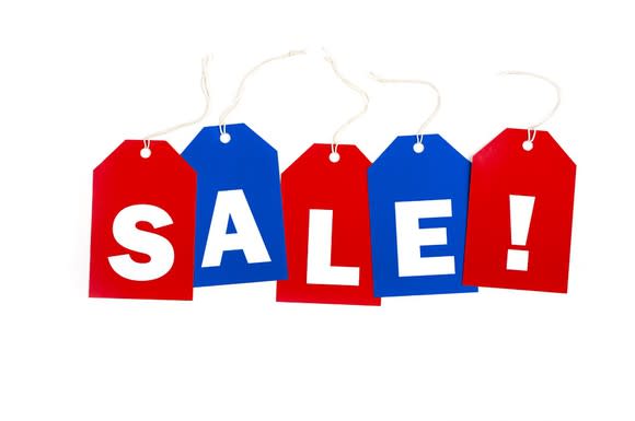 Red and blue price tags with individual letters lined up to spell SALE!