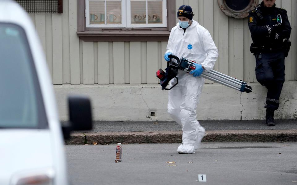 Police work near a site after a man killed some people in Kongsberg, Norway - NTB