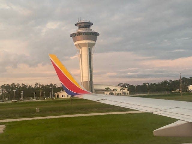A Southwest Airlines plane taxis on the runway at RSW (Southwest Florida International Airport).