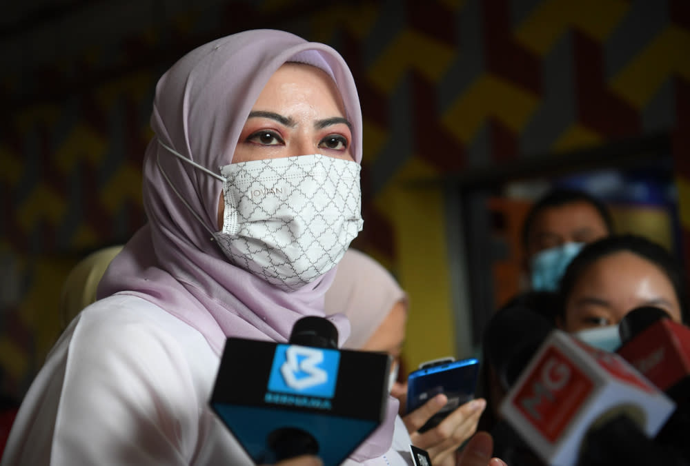 Women, Family and Community Development Minister Datuk Seri Rina Mohd Harun speaks to the media after visiting the family of robbery victim Siti Nur Azizah Syafriadi at the People’s Housing Project in Beringin, Kuala Lumpur, September 2, 2021. — Berna