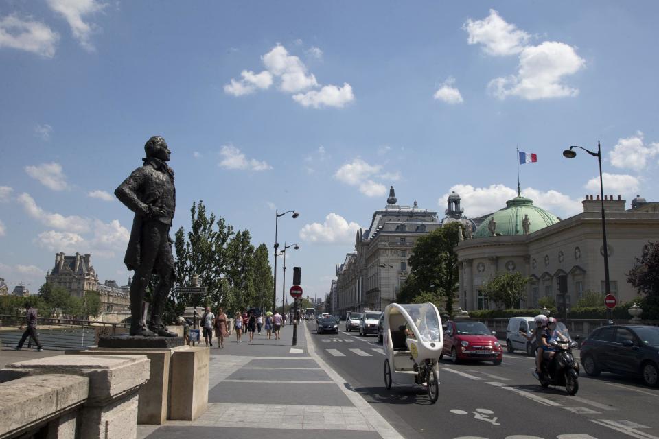 In this photo taken Friday, July 19, 2013, The Statue of Thomas Jefferson, faces the Legion of Honour building, right, in Paris. The building was the inspiration for Jefferson's Monticello house located just outside Charlottesville, Va. (AP Photo/Francois Mori)