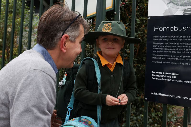 Children return to campus for the first day of New South Wales public schools fully re-opening in Sydney