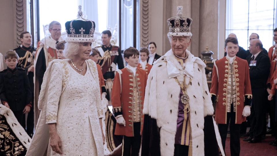 King Charles and Queen Camilla in their robes and crowns after their coronation