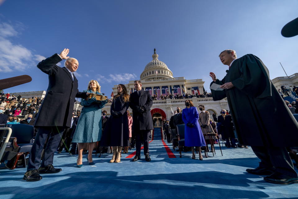 US President-elect Joe Biden is sworn in as the 46th president of the United States by Chief Justice John Roberts as Jill Biden holds the Bible during the inauguration. Source: AAP