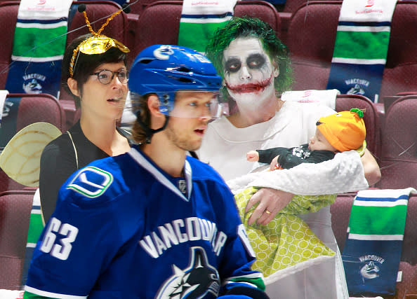 VANCOUVER, BC - OCTOBER 29: Philip Larsen #63 of the Vancouver Canucks skates in front of fans dressed in Halloween costumes before their NHL game against the Washington Capitals at Rogers Arena October 29, 2016 in Vancouver, British Columbia, Canada. (Photo by Jeff Vinnick/NHLI via Getty Images)