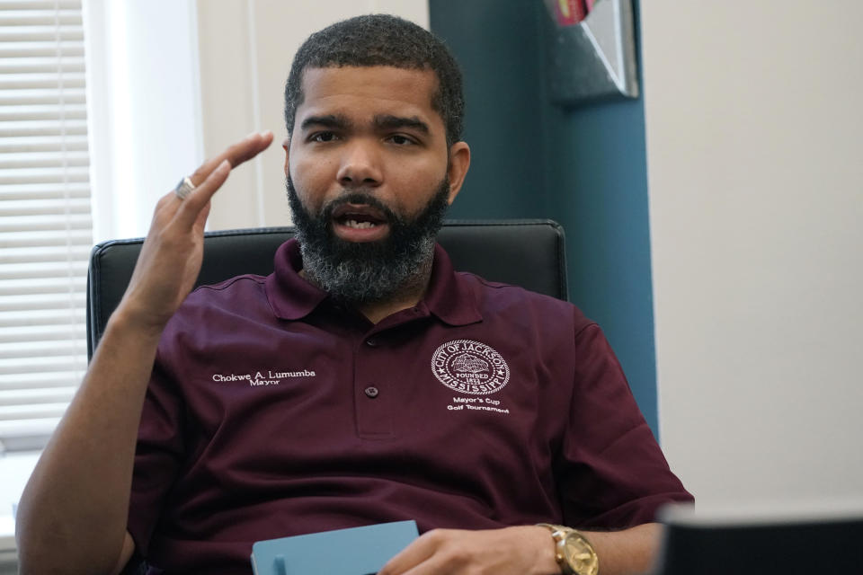 Mayor Chokwe Antar Lumumba, shown in this July 22, 2021, photo taken at his office, has said police roadblocks are "important tools" for police in trying to fight crime in Jackson, Miss. Mississippi Center for Justice sued the city on Feb. 24, 2022, to challenge the constitutionality of police roadblocks. Jackson has been using roadblocks for years, with multiple officers stopping vehicles to check for driver's licenses and auto insurance and to try to find people who are wanted on arrest warrants. (AP Photo/Rogelio V. Solis)