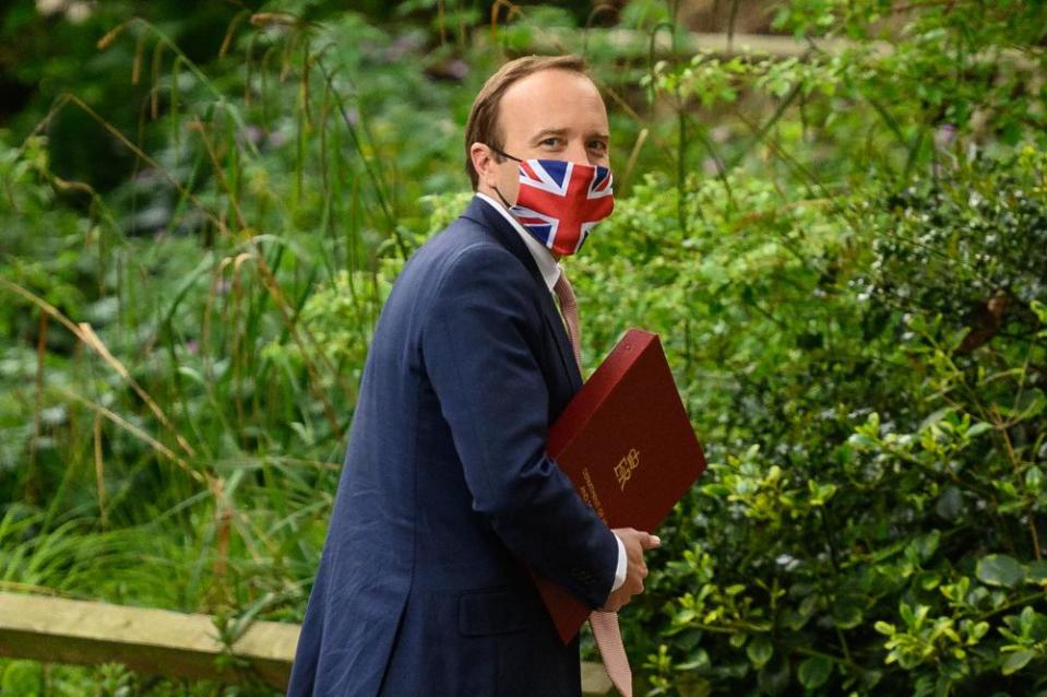 Health secretary Matt Hancock wearing a ‘union jack’ face mask last month.