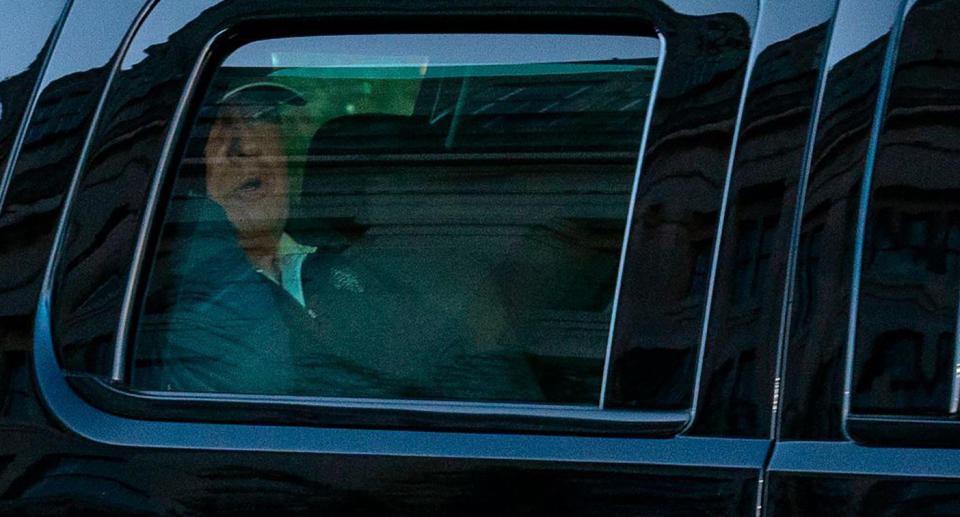 Donald Trump in a car after losing his presidency to Joe Biden. 