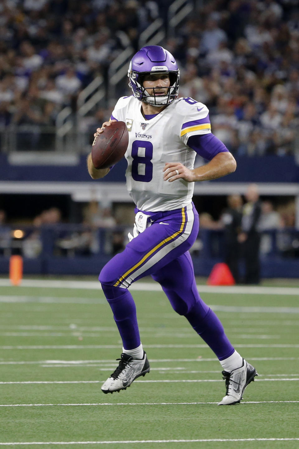 Minnesota Vikings quarterback Kirk Cousins scrambles our of the pocket during the second half of the team's NFL football game against the Dallas Cowboys in Arlington, Texas, Sunday, Nov. 10, 2019. (AP Photo/Michael Ainsworth)